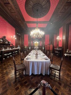 a dining room with a chandelier and a table