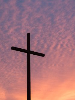 silhouette of large cross during daytime